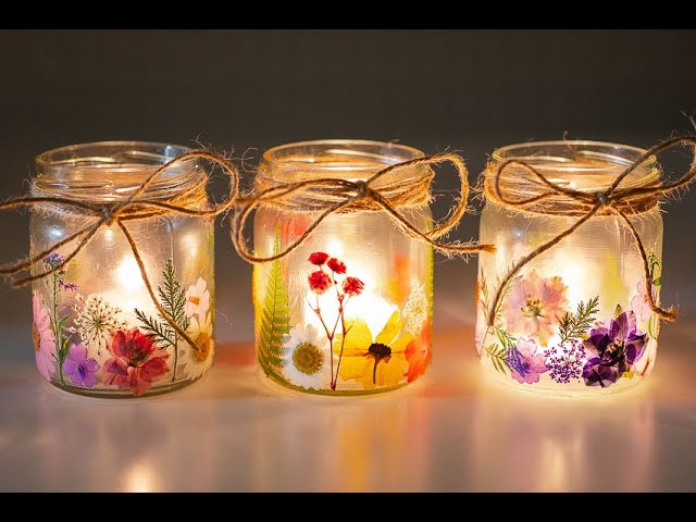 Glass jars decorated with pressed flowers